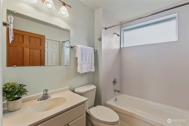 full bathroom with bathtub / shower combination, vanity, and toilet