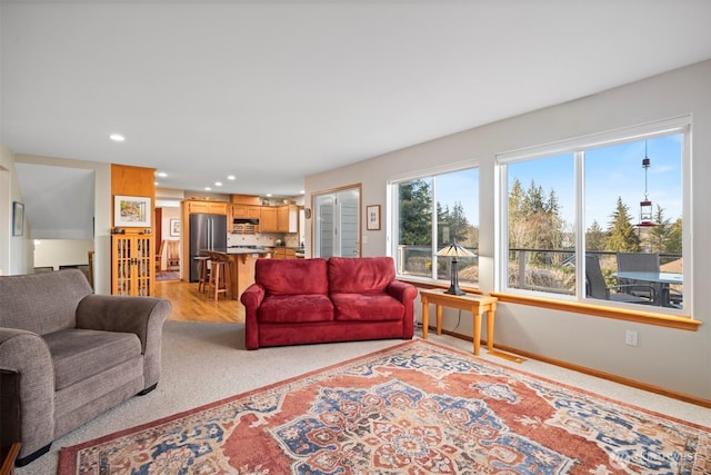 living area with recessed lighting and baseboards