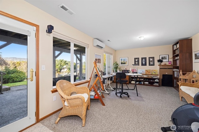 carpeted home office featuring visible vents, baseboards, and an AC wall unit