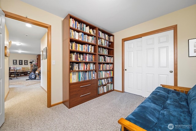 sitting room with carpet flooring and baseboards