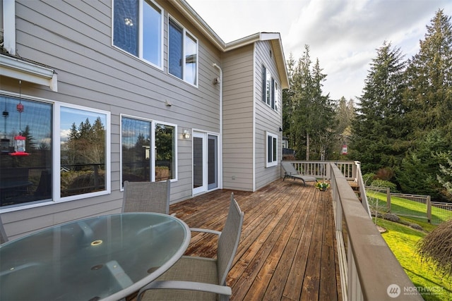 deck featuring outdoor dining area