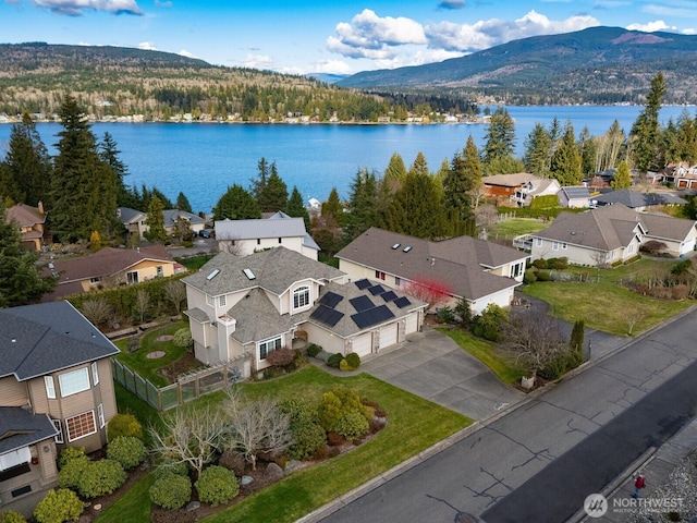 bird's eye view with a residential view and a water and mountain view