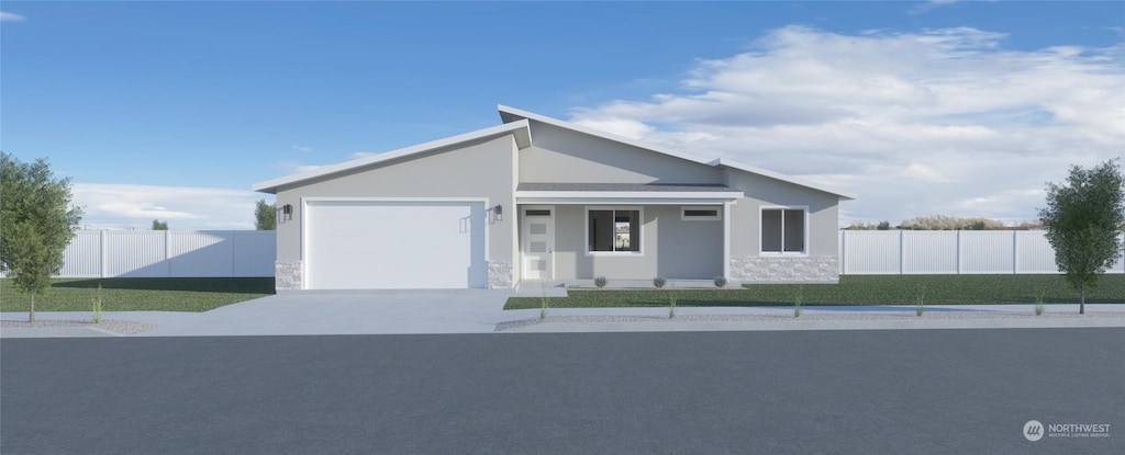 view of front of house with a garage and a front lawn