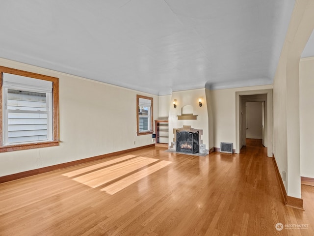 unfurnished living room featuring hardwood / wood-style floors