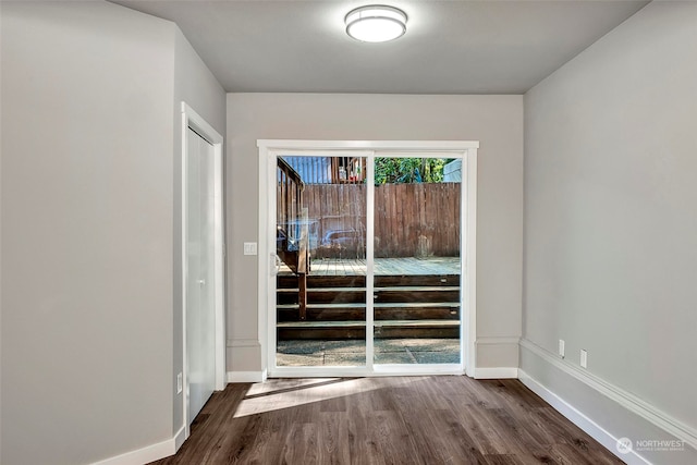 entryway with dark hardwood / wood-style floors