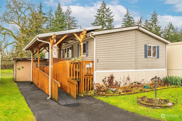 view of property exterior with a lawn