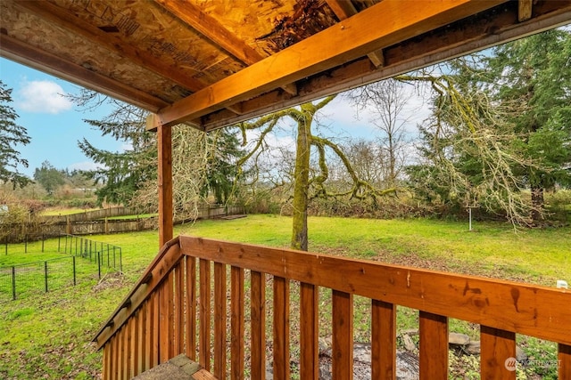 wooden terrace with a lawn