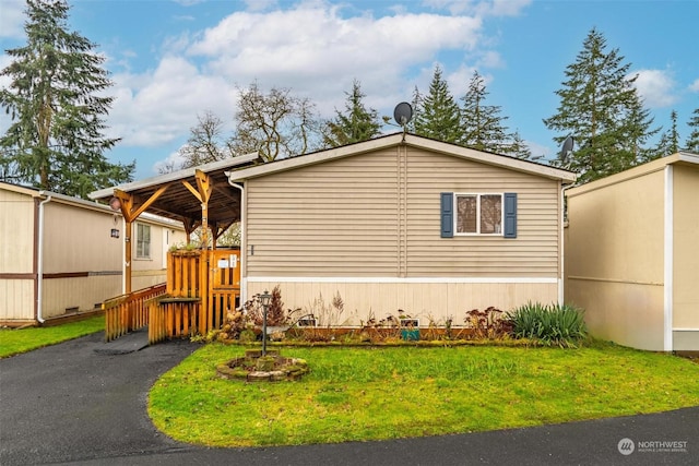 view of home's exterior featuring a lawn