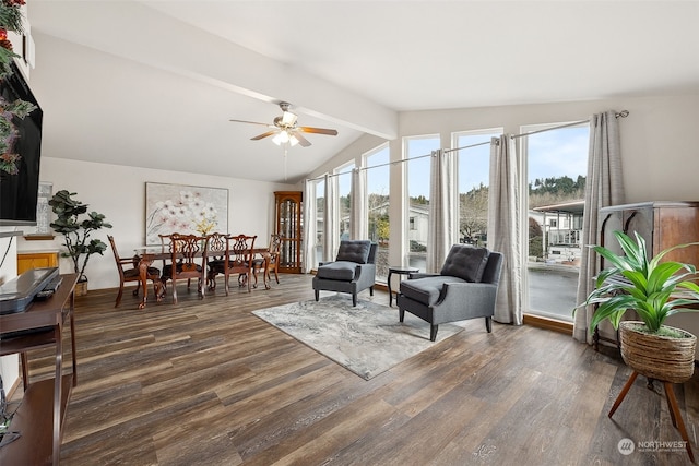 sunroom / solarium with ceiling fan and lofted ceiling with beams