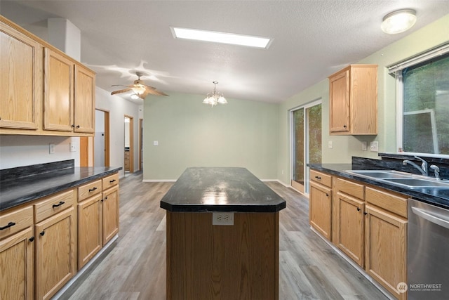 kitchen with a kitchen island, lofted ceiling, sink, stainless steel dishwasher, and light hardwood / wood-style flooring