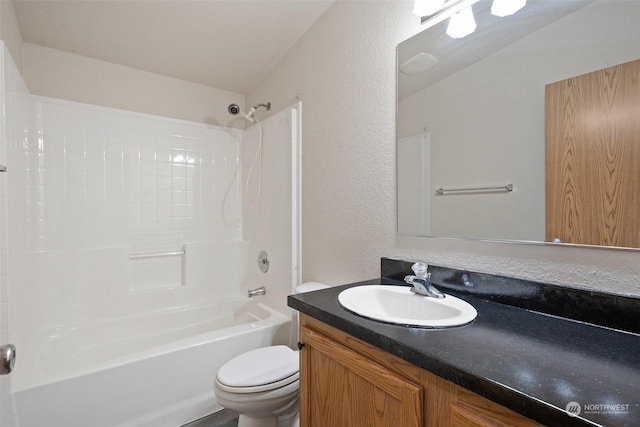 full bathroom with shower / tub combination, vanity, and toilet