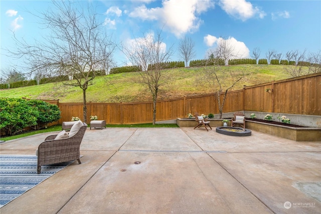 view of patio / terrace with a fire pit