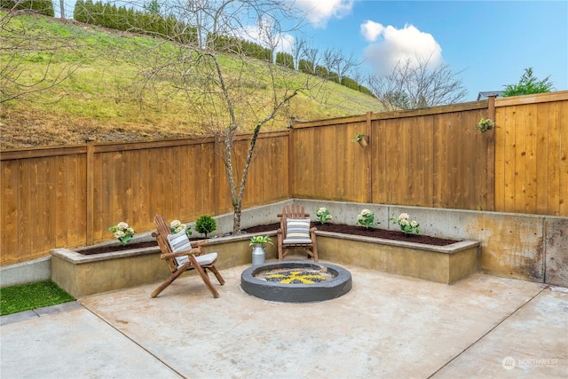 view of patio with a fire pit