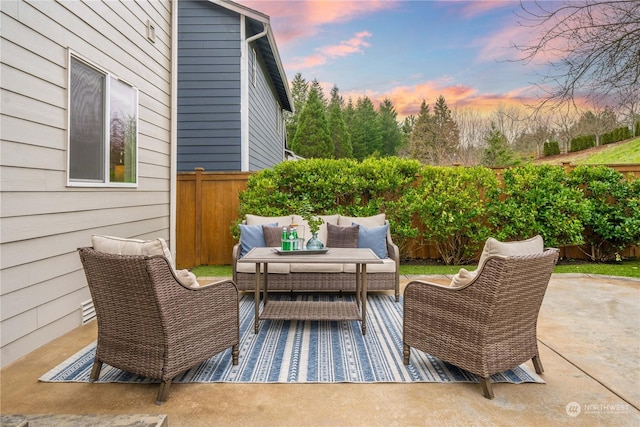 patio terrace at dusk with an outdoor living space