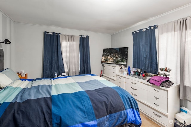 bedroom featuring light colored carpet and crown molding