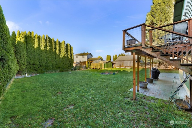 view of yard with a patio and a deck