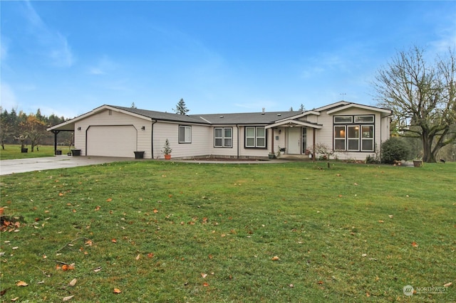 view of front of property with a front yard, a garage, and a carport