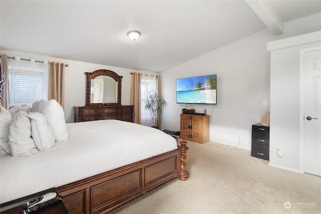 bedroom with light colored carpet and lofted ceiling with beams