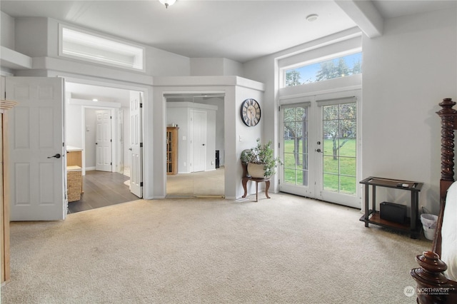 entryway with carpet and french doors