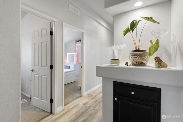 hallway featuring light hardwood / wood-style floors