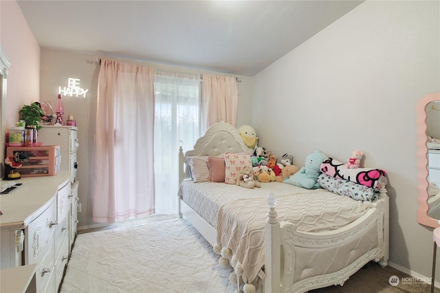 bedroom featuring light carpet