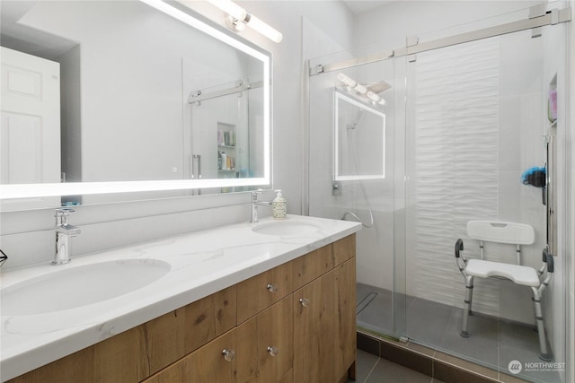 bathroom with vanity, tile patterned floors, and a shower with shower door