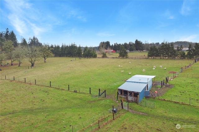 birds eye view of property with a rural view