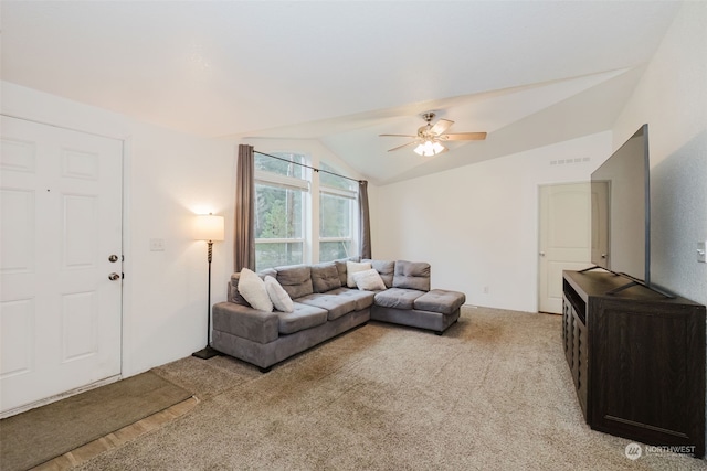 living room featuring ceiling fan, light colored carpet, and vaulted ceiling