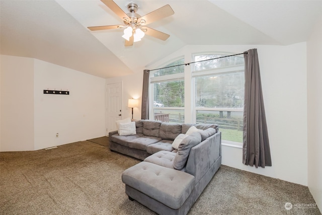 living room featuring ceiling fan, carpet, and vaulted ceiling