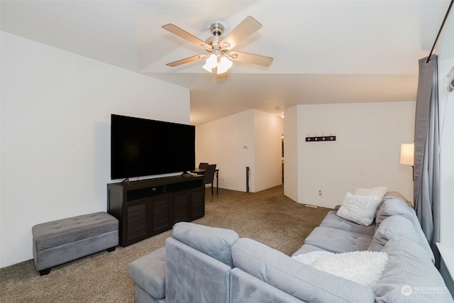 living room featuring light colored carpet, vaulted ceiling, and ceiling fan