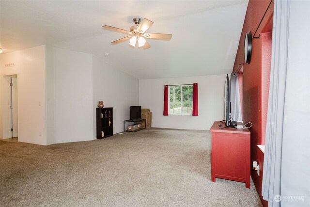 carpeted living room featuring vaulted ceiling and ceiling fan