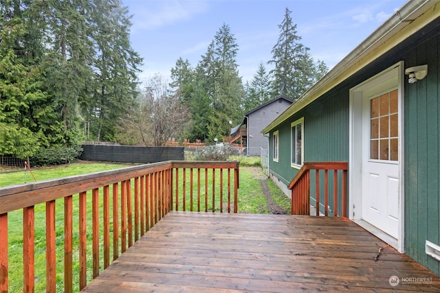 wooden deck with a yard