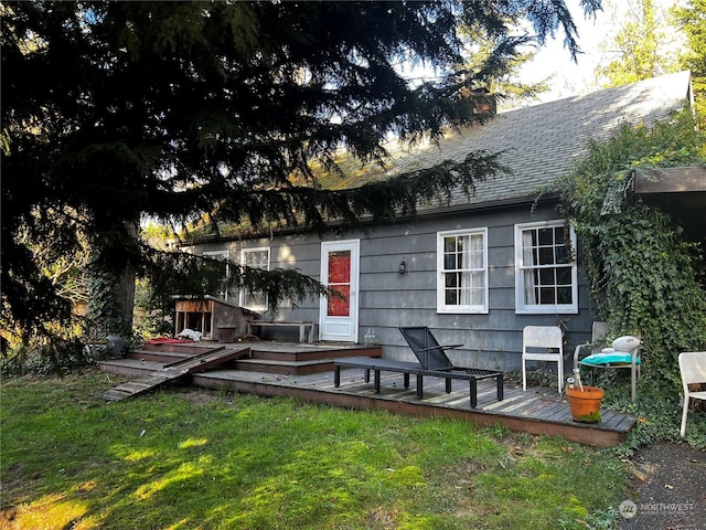 exterior space with a deck and a yard