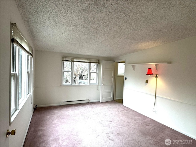 spare room featuring carpet floors, a textured ceiling, and a baseboard radiator