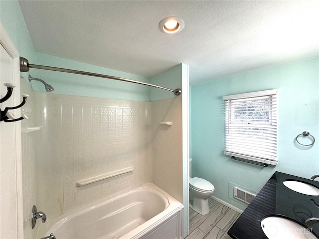 full bath with  shower combination, toilet, visible vents, and a sink