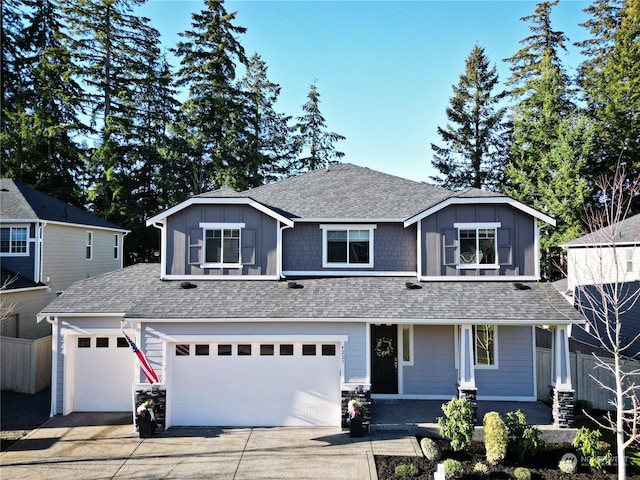 view of front of home with a garage and a porch