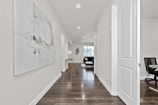 hall with dark hardwood / wood-style flooring