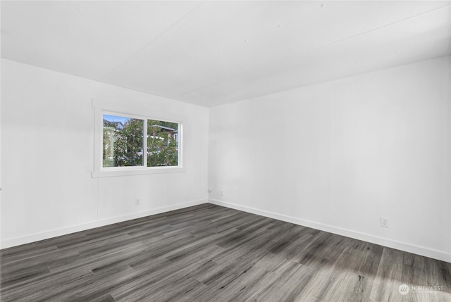 unfurnished room featuring dark hardwood / wood-style flooring