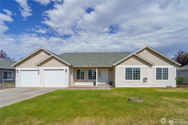 150 K St NE, Ephrata, WA 98823 - single story home with driveway, a front lawn, a garage, and roof with shingles
