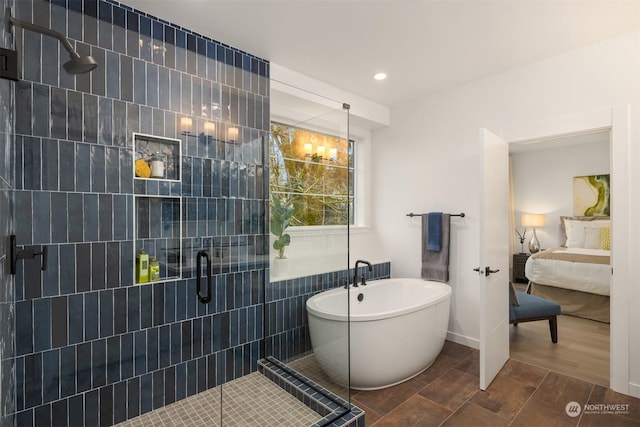 bathroom featuring separate shower and tub, tile walls, and hardwood / wood-style flooring