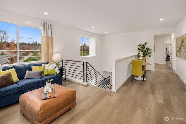 living room with light hardwood / wood-style flooring