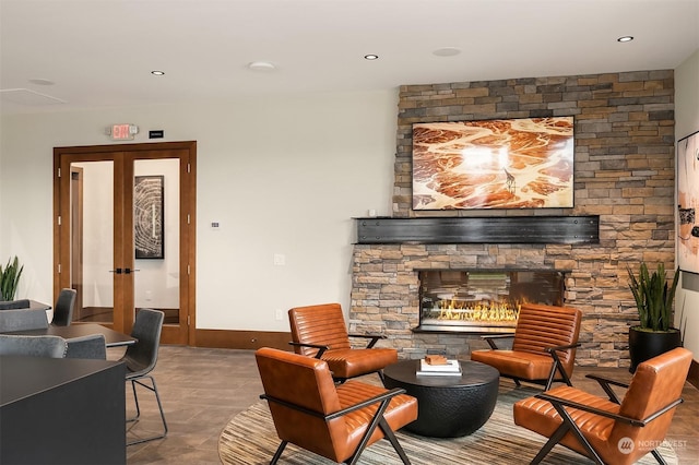 interior space featuring tile patterned floors, a fireplace, and french doors