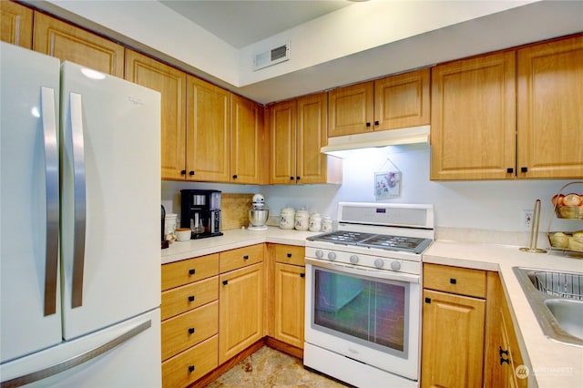 kitchen with white appliances and sink