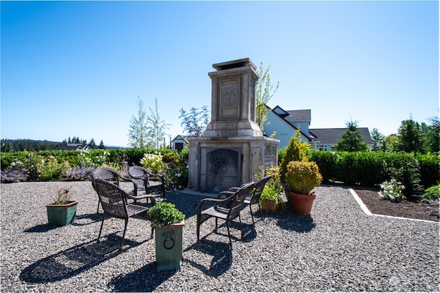 view of patio featuring exterior fireplace