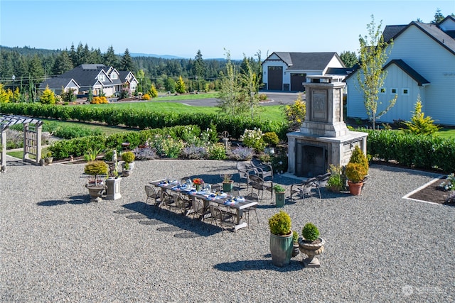 view of yard featuring a patio area and an outdoor fireplace