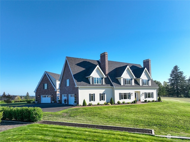 view of front of home featuring a garage and a front lawn