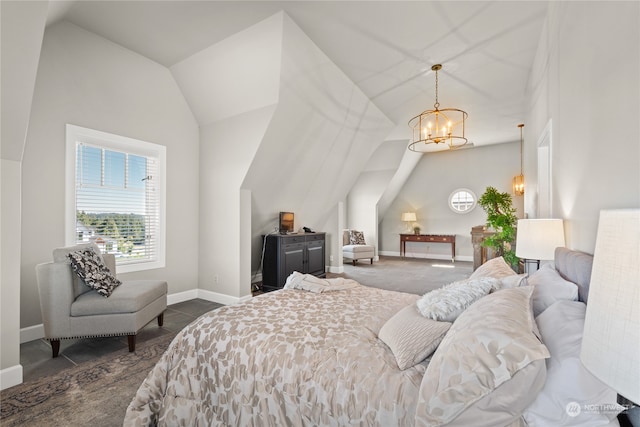 bedroom featuring a chandelier and vaulted ceiling