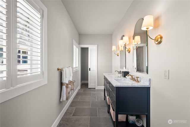 bathroom featuring vanity and a chandelier