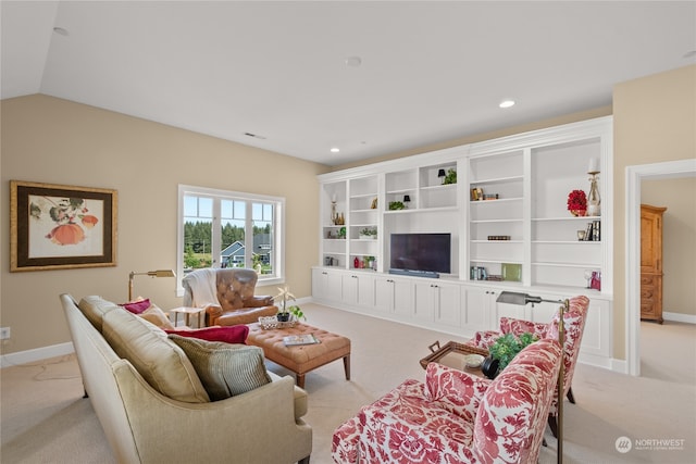 living room featuring light colored carpet and vaulted ceiling