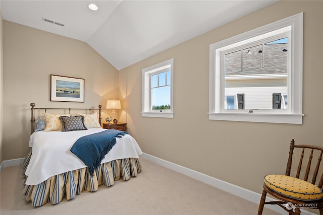 carpeted bedroom featuring vaulted ceiling